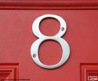 Изображение из числа 8, серебристый цвет на красный двери